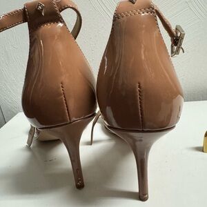 Ladies tan patent leather ankle strap kitten heels by Sam Edelman.